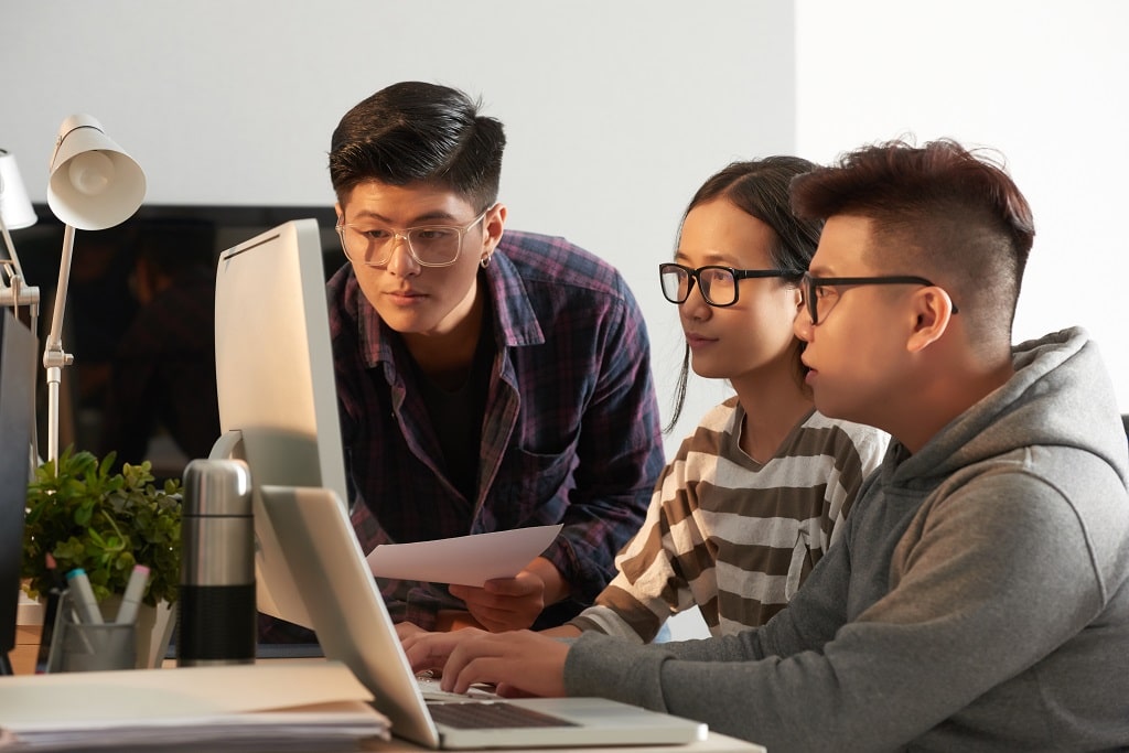 a group of CIITzens collaborating on a school activity that involves web programming languages