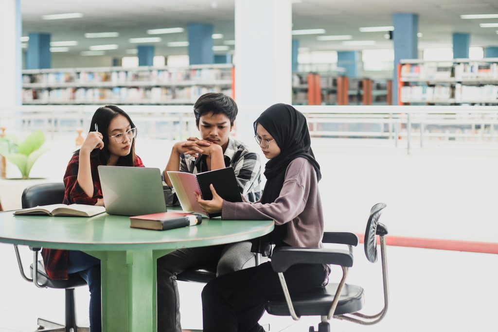 group of abm students studying together at library