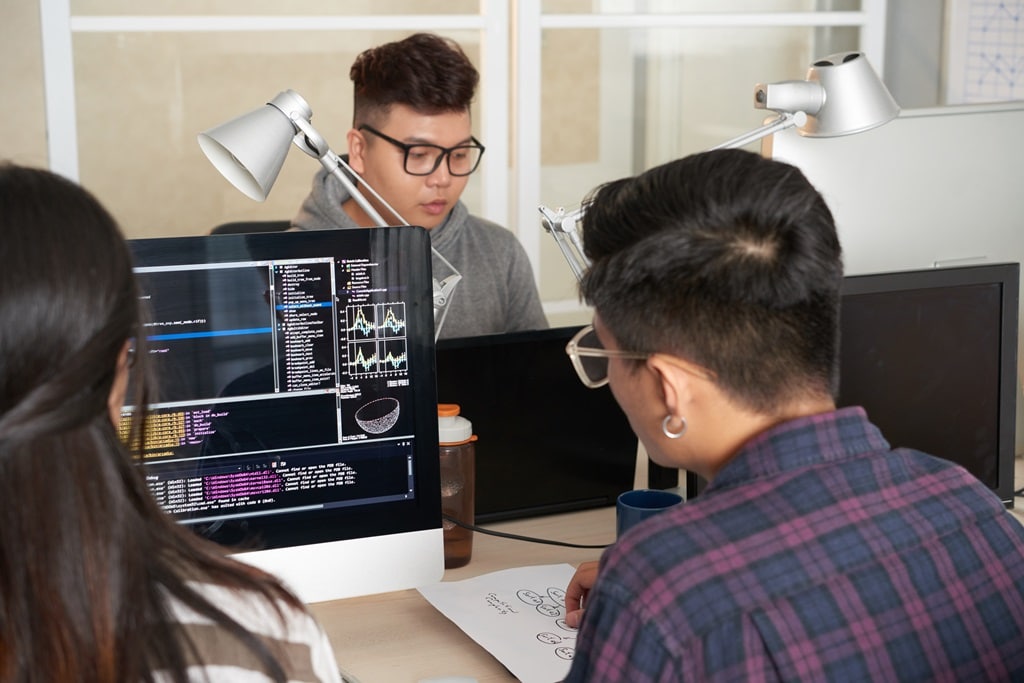 group of programmers in a modern workplace