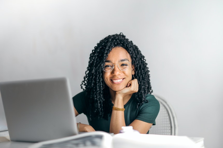 Happy female student in an online learning setup