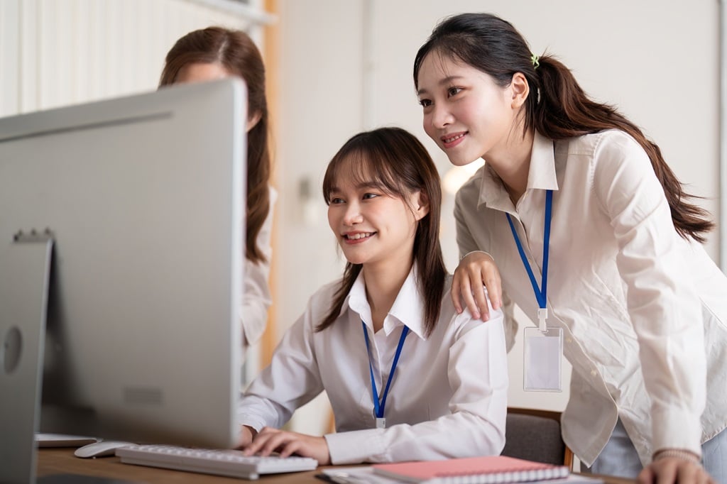 SHS programming course students using a laptop