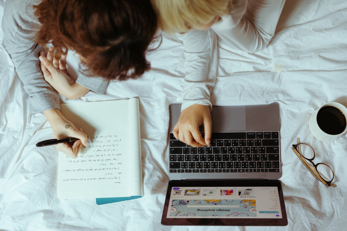 Students taking online courses indoors