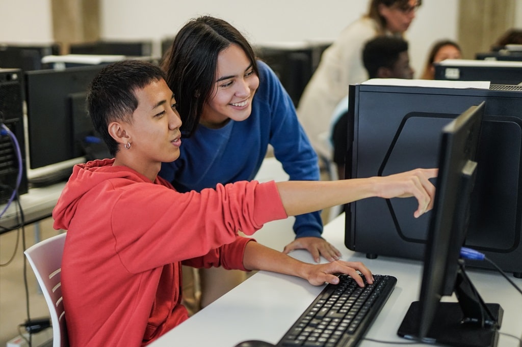 two students analyzing different types of 3D animation together