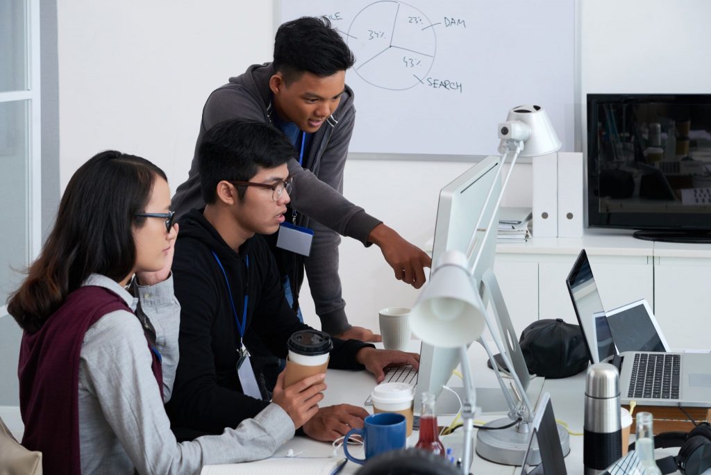 A group of web developers discussing about Python programming language.