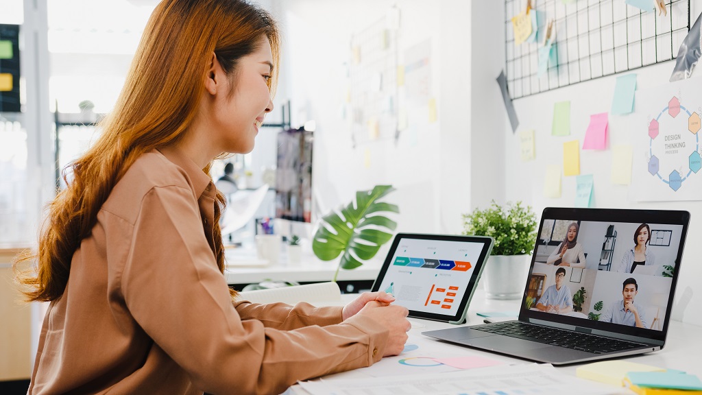 A woman digital marketer conducting online meeting