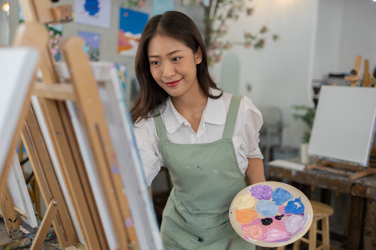 young artist experimenting with a spectrum of colors