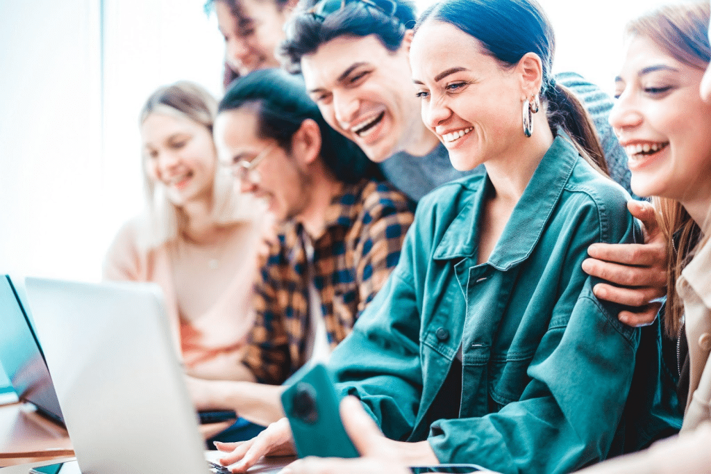 computer science students sharing content on laptop